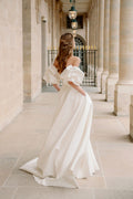 Woman wearing Monique Lhuillier Fall 2023 Bliss white strapless sweetheart BL23201 ballgown with tufted sleeves