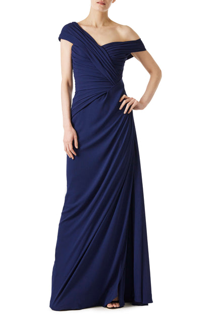 Monique Lhuillier navy gown with draped neckline and high leg slit in jersey chiffon fabric.