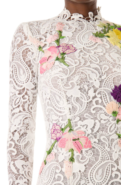 Monique Lhuillier midi length, long sleeve white lace dress with floral embroidery.