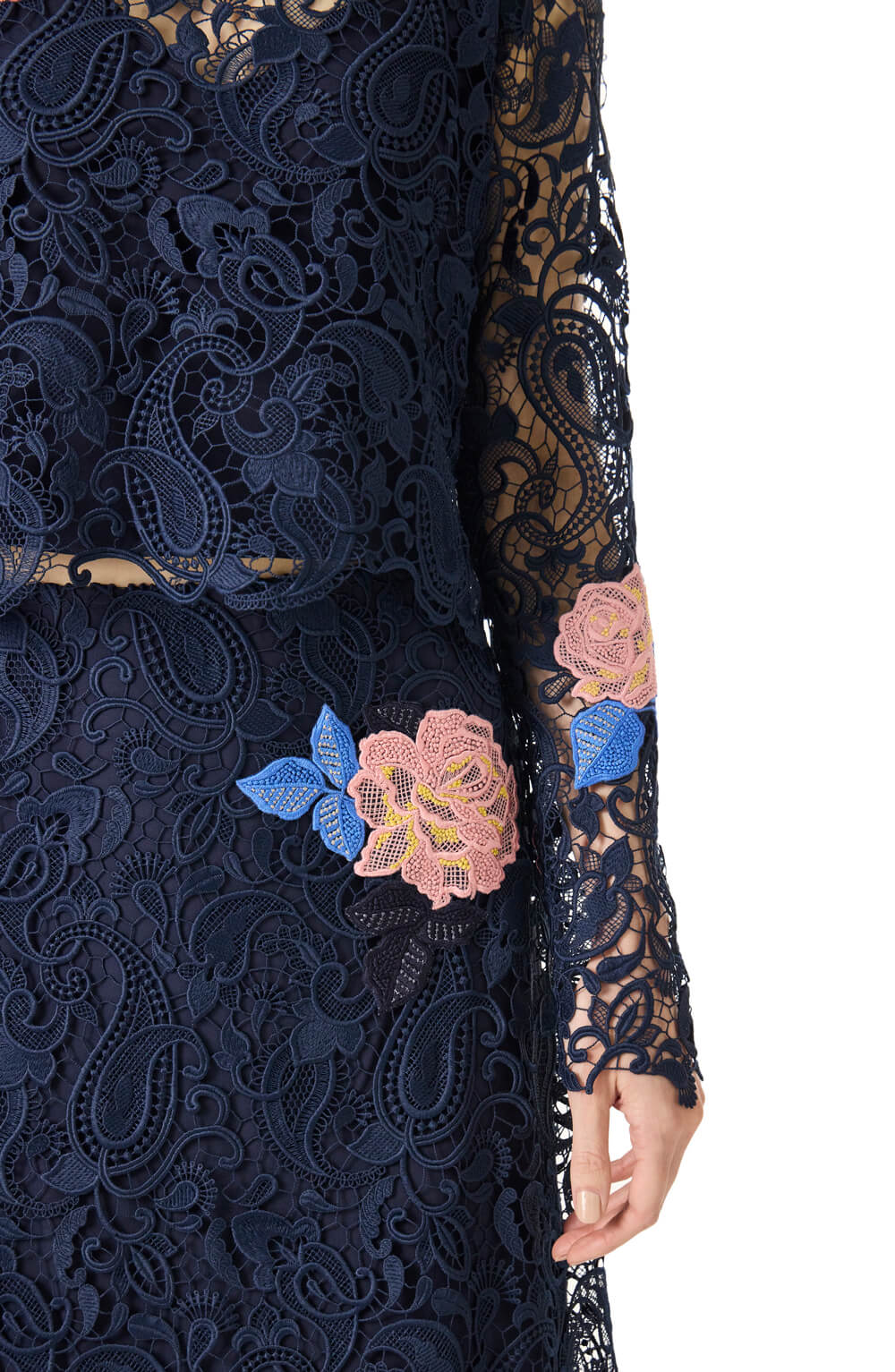 Monique Lhuillier long sleeve navy lace top with pink lace flowers.