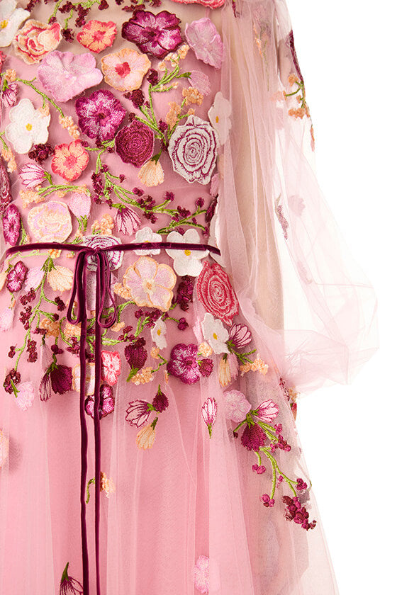 Monique Lhuillier jewel neck midi dress with sheer long sleeves in pink tulle and 3d floral embroidery.