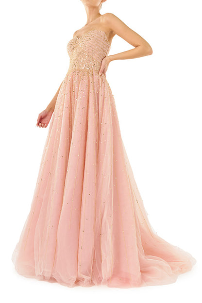 Monique Lhuillier strapless ballgown in rose colored tulle and gold embroidery.