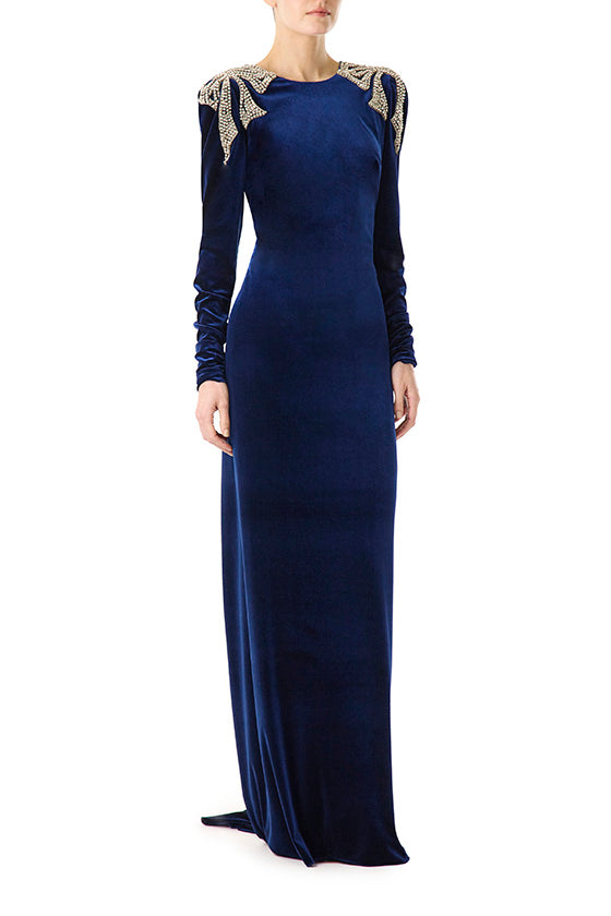 Monique Lhuillier navy velour gown with long sleeves, ruched back and embroidery.