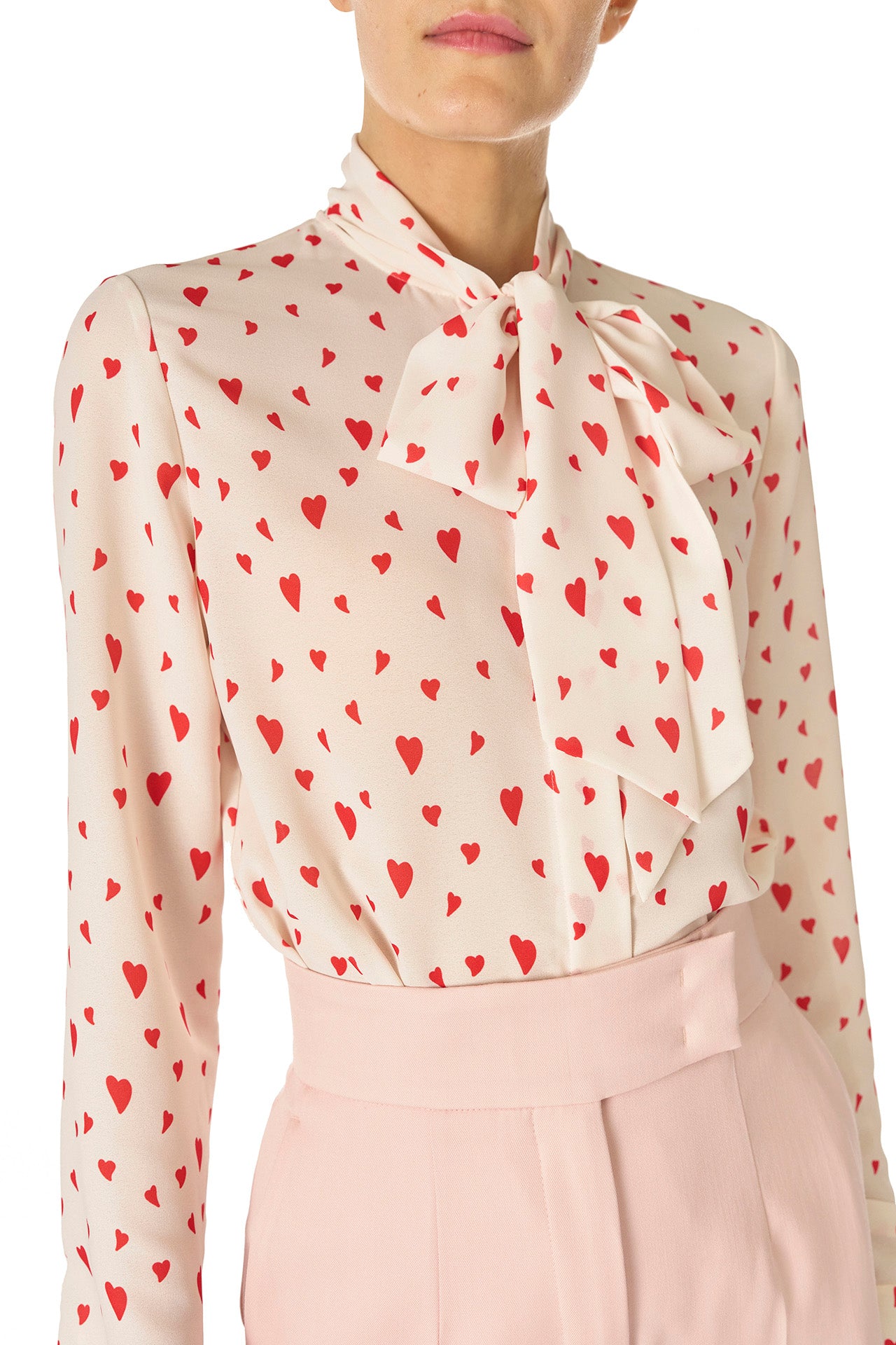 Monique Lhuillier Fall 2024 long sleeve, bow tie blouse in Heart Printed Georgette - front crop.