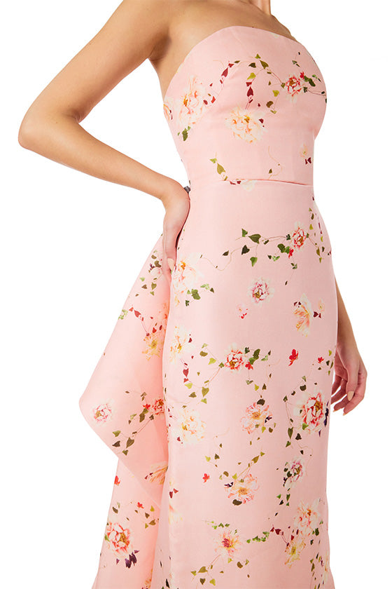 Monique Lhuillier strapless column gown in pink peony flora gazar fabric with tufted bustle train.