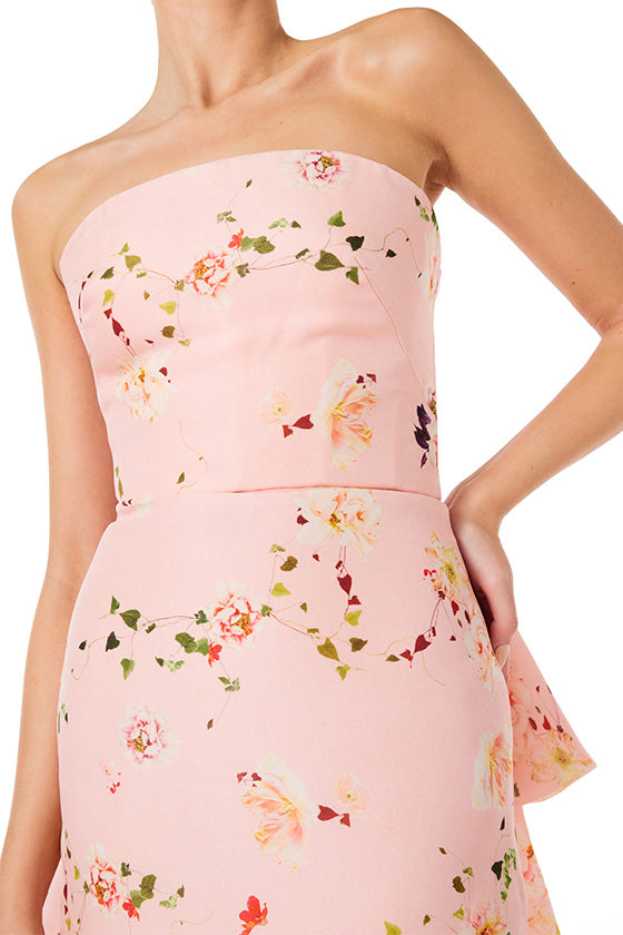 Monique Lhuillier strapless column gown in pink peony flora gazar fabric with tufted bustle train.