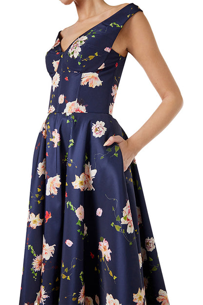 Monique Lhuillier navy floral midi dress with off the shoulder neckline, fit & flare skirt and pockets.