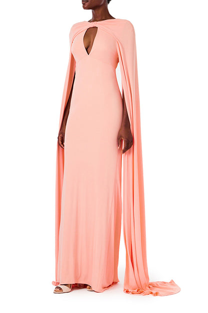 Monique Lhuillier melon colored crepe-back satin gown with attached cape and keyhole bodice.