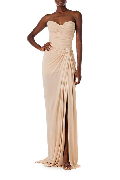 Monique Lhuillier strapless floor length gown with sweetheart neckline and high front leg slit in sand colored matte jersey fabric.