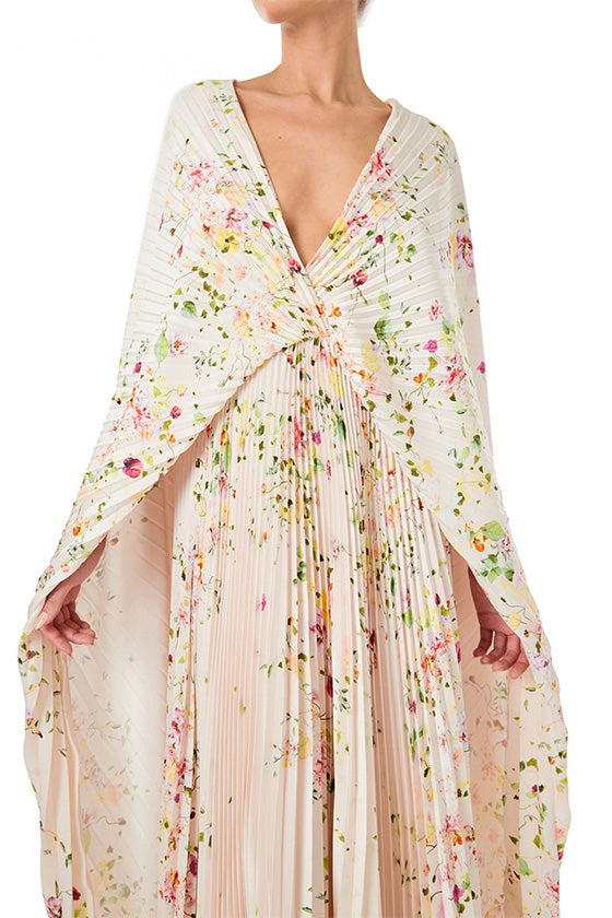 Monique Lhuillier floral printed plisse caftan with deep v neckline and cape sleeves.