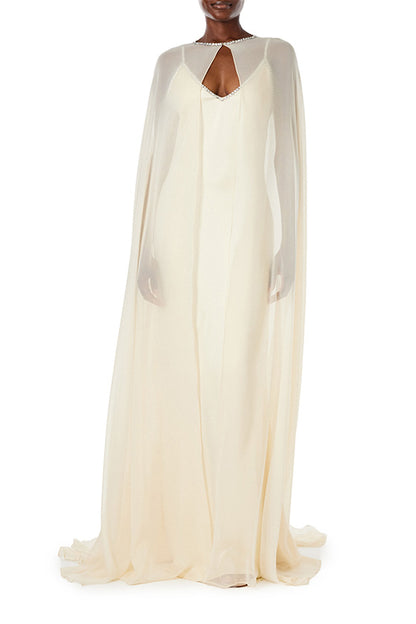 Monique Lhuillier creme chiffon cape with crystal neckline over satin slip gown.