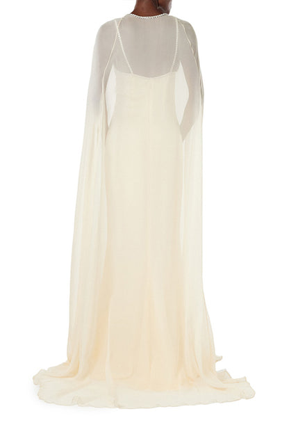 Monique Lhuillier creme chiffon cape with crystal neckline over satin slip gown.