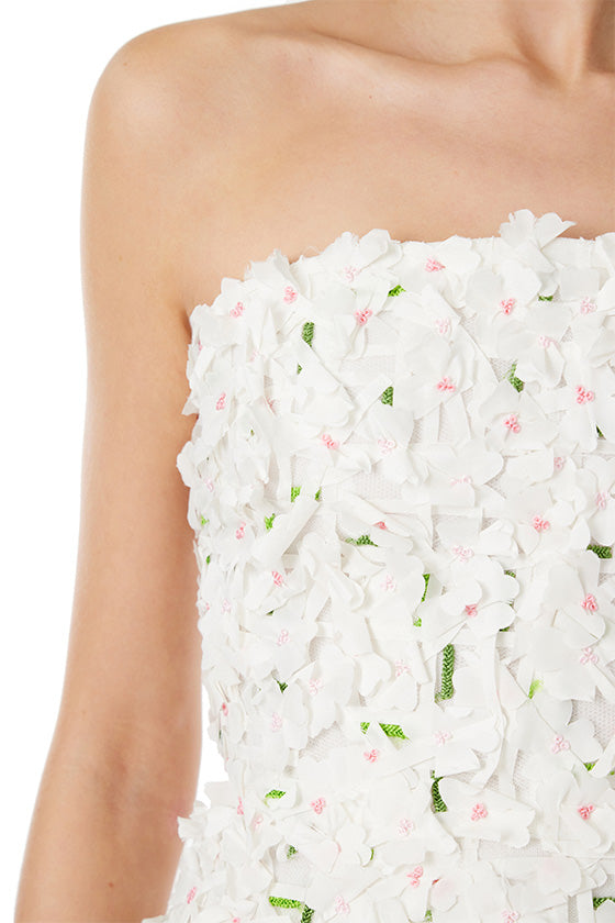 Monique Lhuillier strapless cocktail dress in silk white floral embroidery with hints of green and pink.