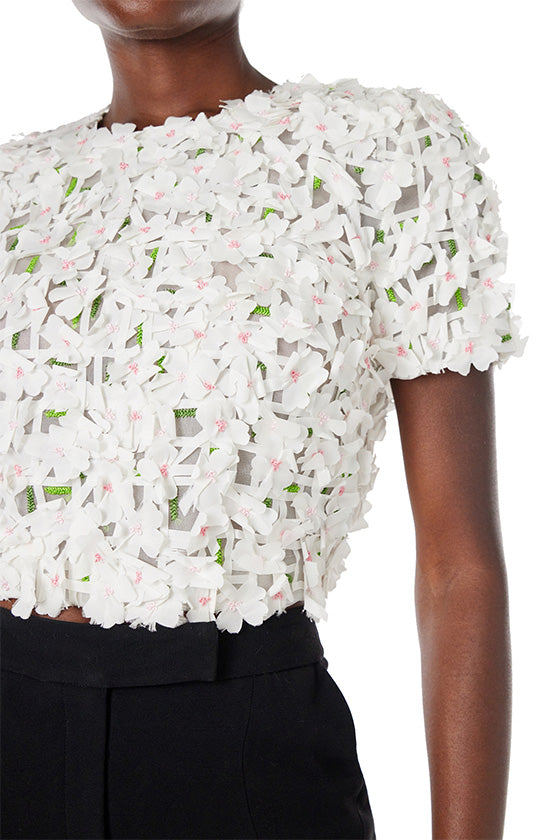 Monique Lhuillier crop top with short sleeves in silk white floral embroidery.