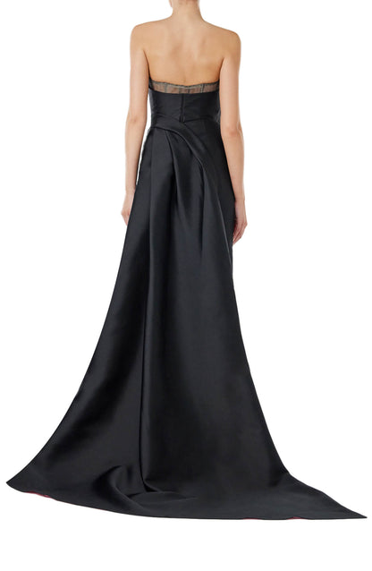 Monique Lhuillier strapless column gown in black silk faille with pink bi-color train.