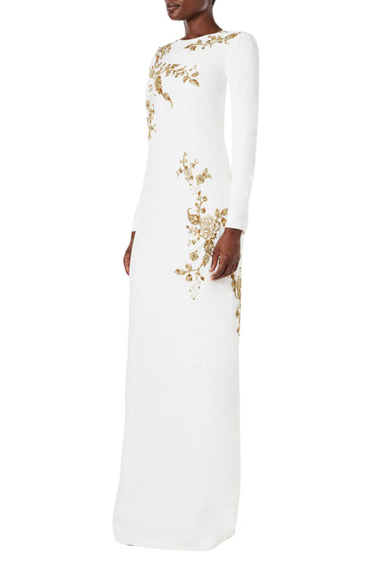 Monique Lhuillier silk white jewel neck, long sleeve column gown with gold embroidery.