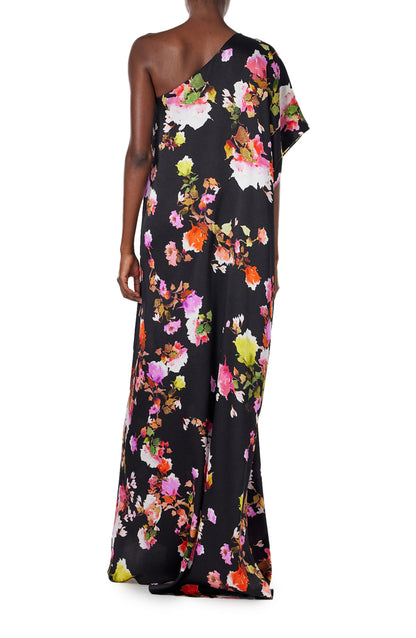 Monique Lhuillier Spring 2024  one shoulder caftan with bias flounce in noir/multi floral hammered silk - back.