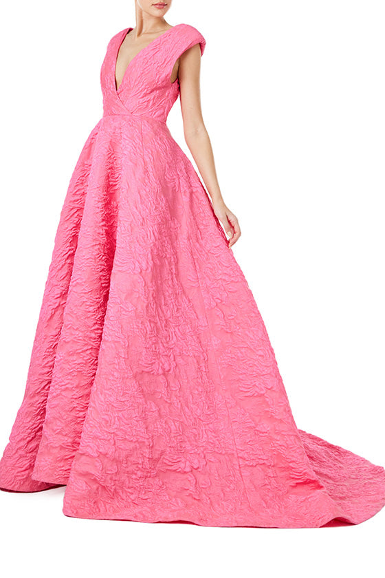 Monique Lhuillier Spring 2024 fuchsia jacquard ballgown with deep v neckline - left side.