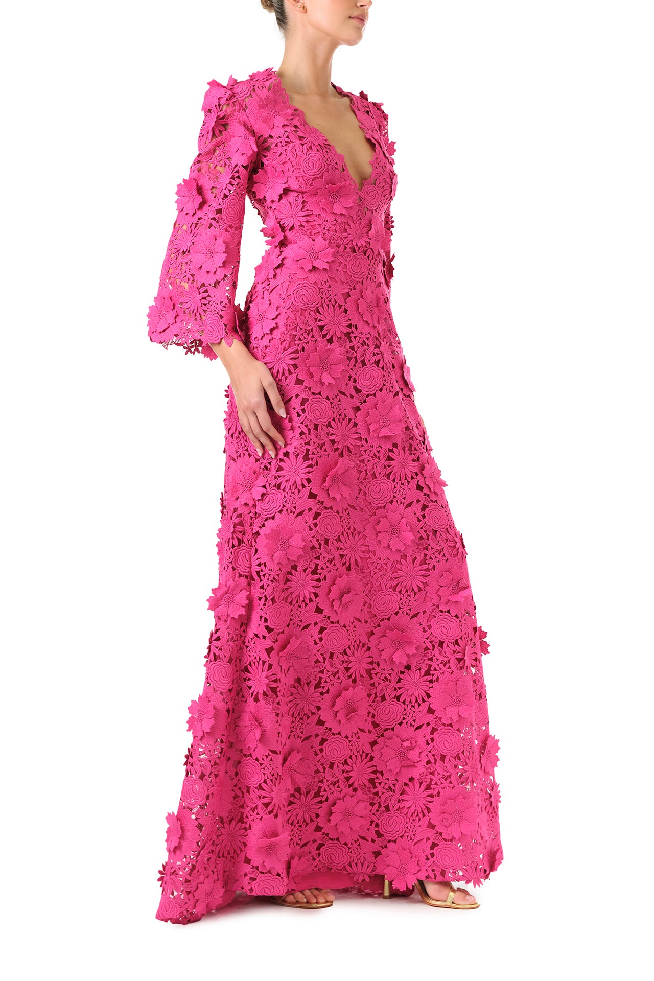 Monique Lhuillier Fall 2024 bell sleeve, floor length gown with deep v-neckline in Fuchsia 3D Guipure Lace - right side.