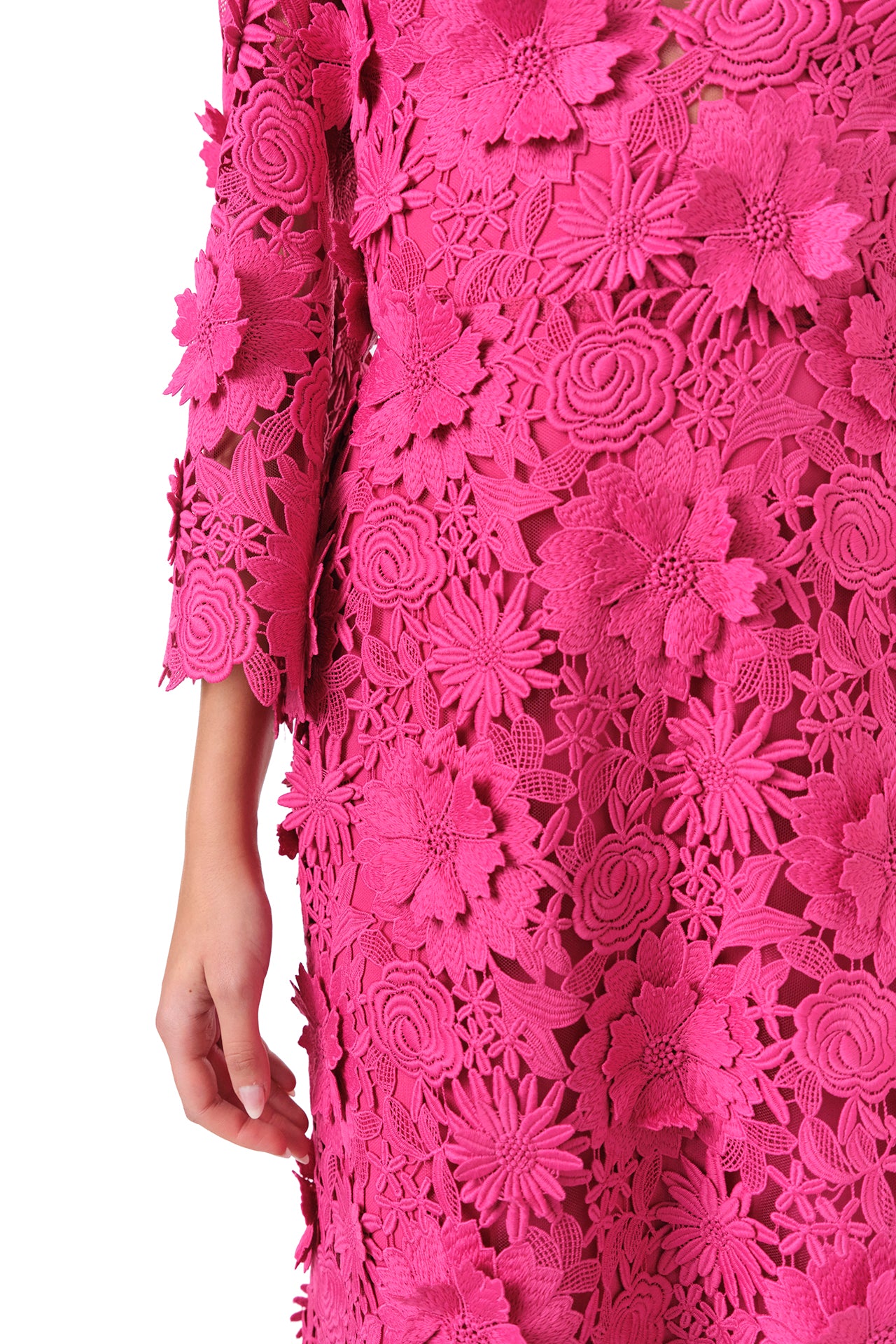Monique Lhuillier Fall 2024 bell sleeve, floor length gown with deep v-neckline in Fuchsia 3D Guipure Lace - fabric detail.