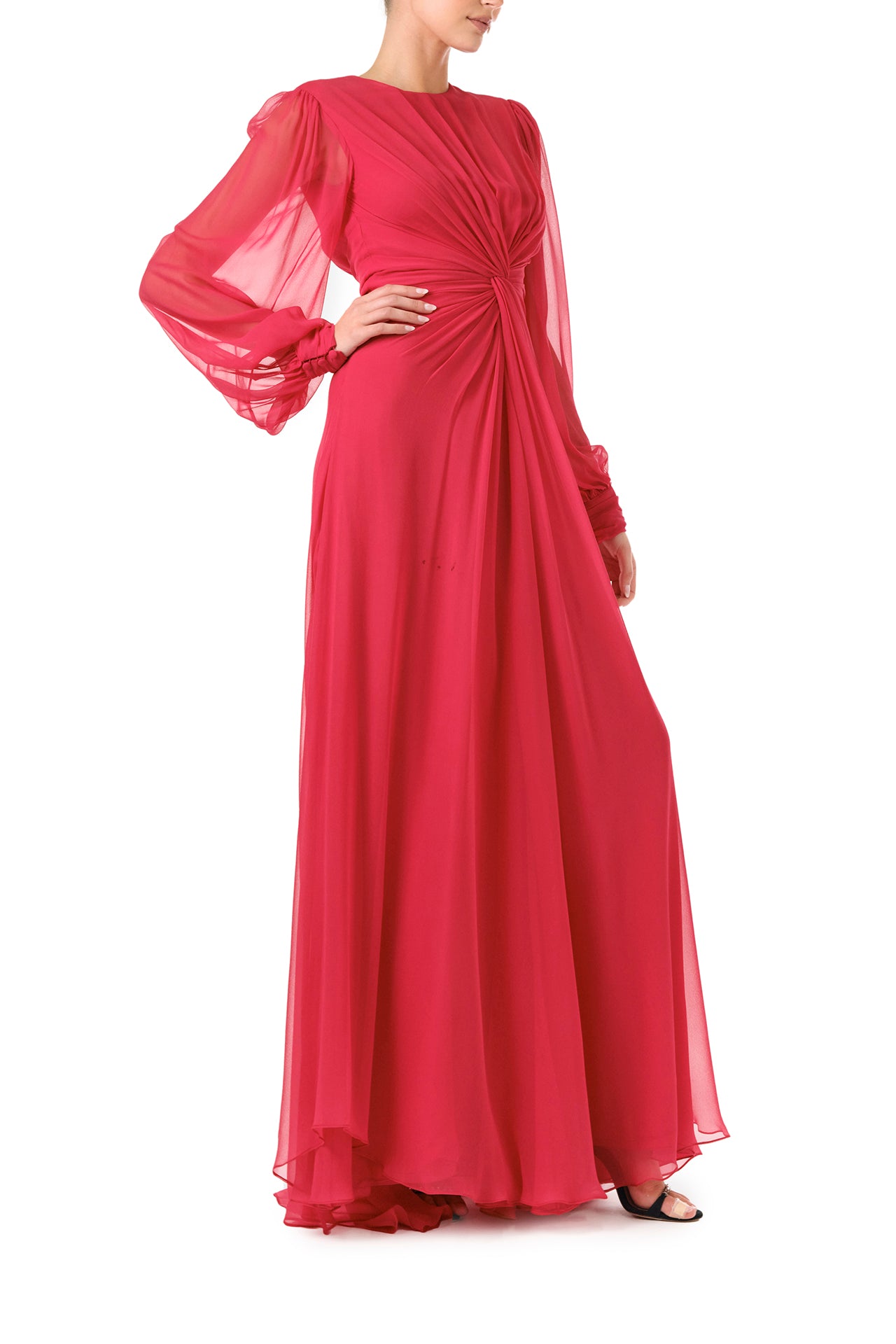 Monique Lhuillier Fall 2024 pomegranate chiffon, long sleeve gown with twist front detail, keyhole back and semi-sheer sleeves - right side.