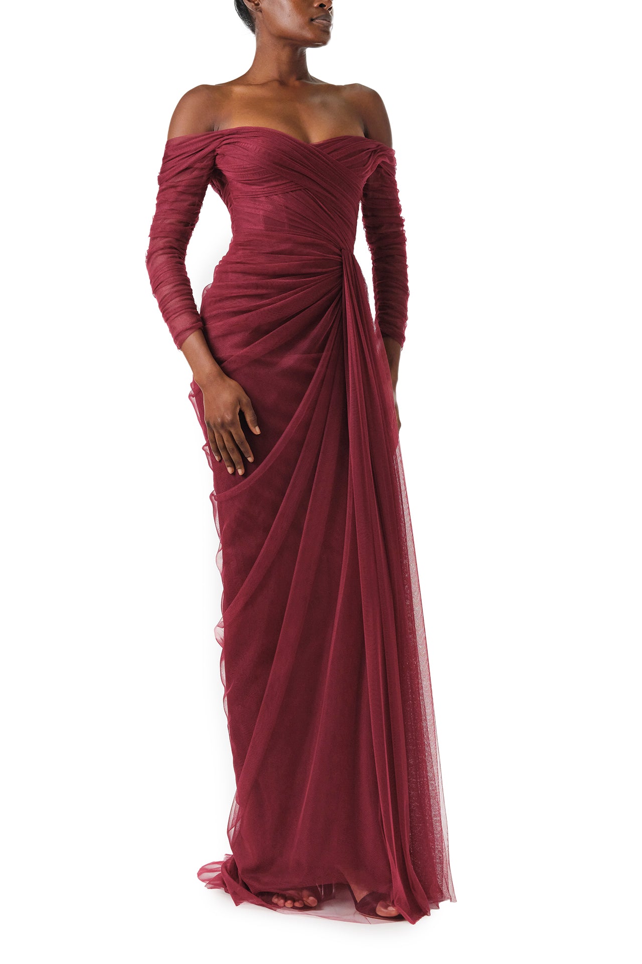 Monique Lhuillier Fall 2024 Off the shoulder draped tulle gown with low V-back, long sleeves and corseted bodice in Merlot - side.