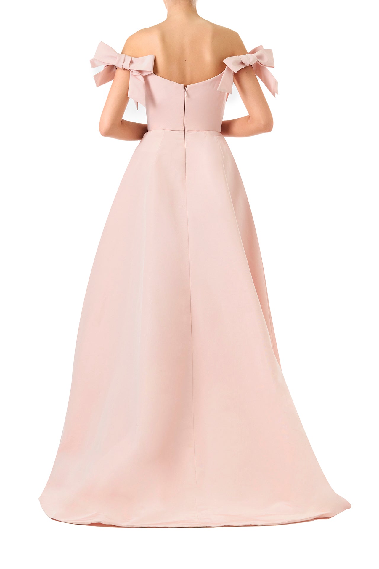 Monique Lhuillier Fall 2024 off the shoulder bow sleeve gown in pale blush faille with full skirt and high leg slit - back.