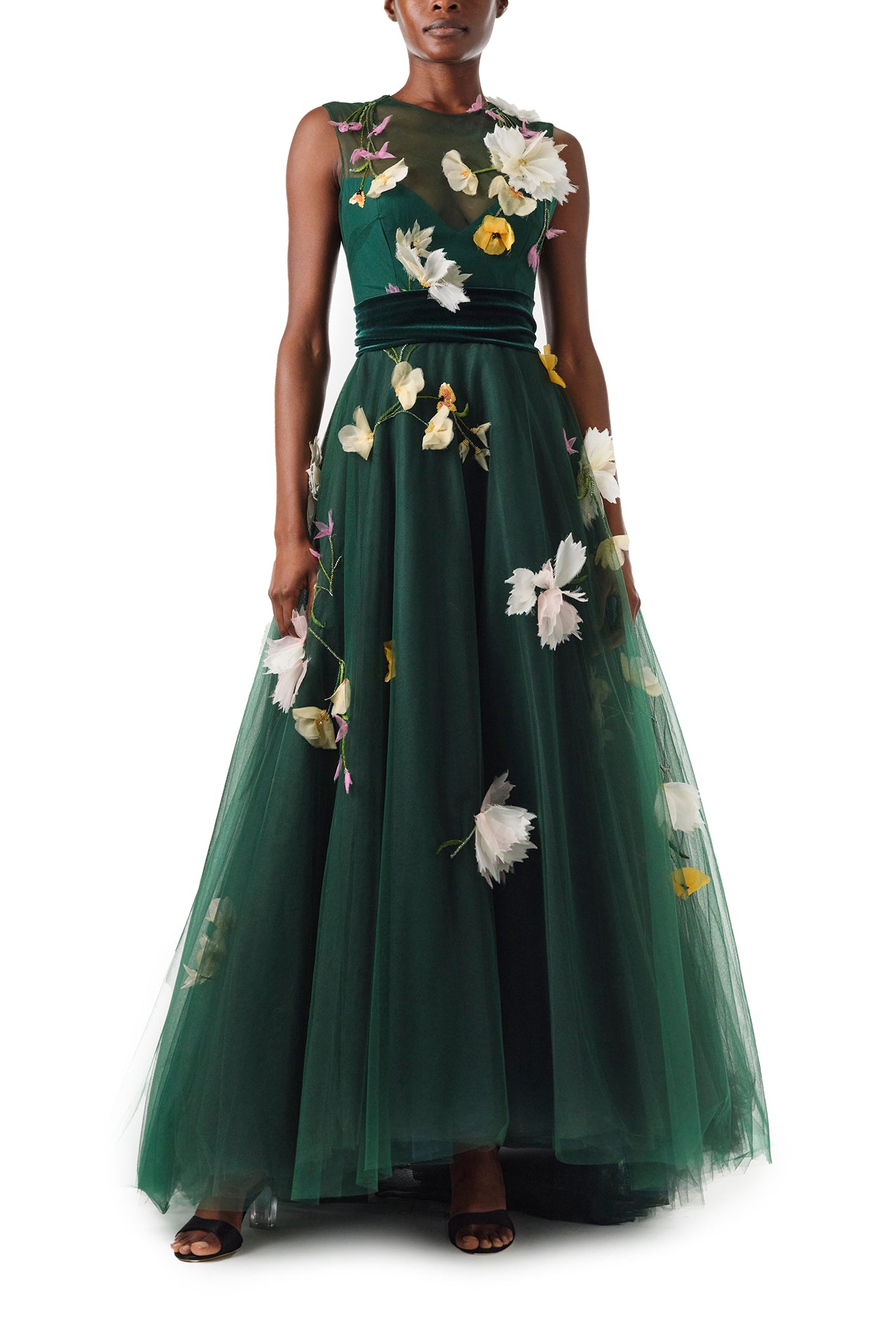 Monique Lhuillier Fall 2024 sleeveless, green tulle gown with floral embroidery, illusion neckline, full A-line skirt and velvet cummerbund at waist - front.