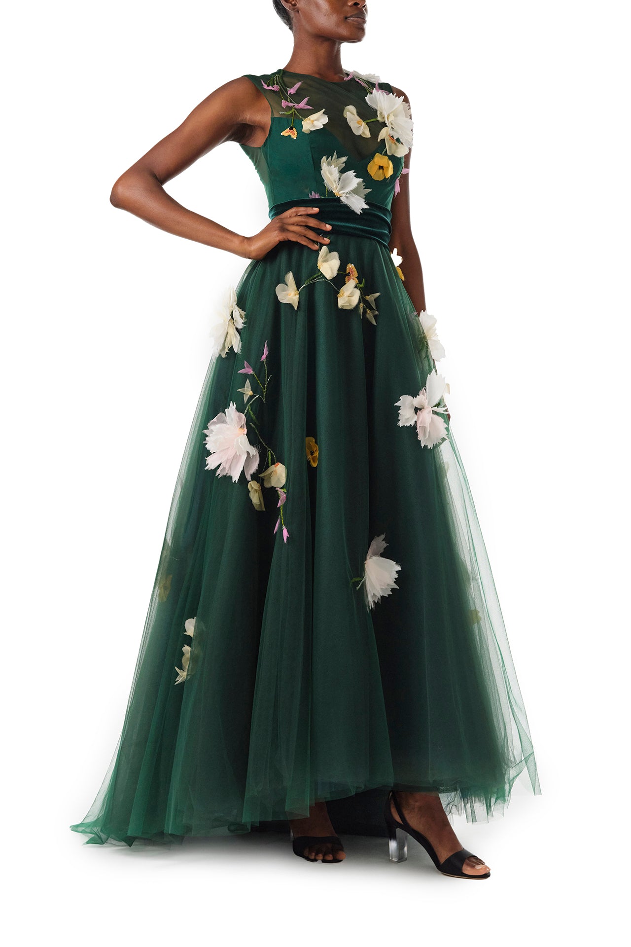 Monique Lhuillier Fall 2024 sleeveless, green tulle gown with floral embroidery, illusion neckline, full A-line skirt and velvet cummerbund at waist - right side.