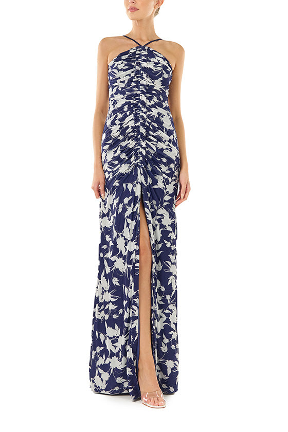 ML Monique Lhuillier floor length dress with halter neckline and ruching in indigo printed mesh.