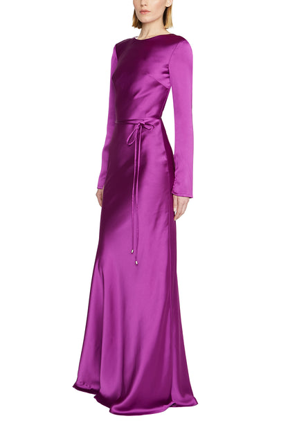 ML Monique Lhuillier purple long sleeve, jewel neckline gown with keyhole back and narrow sash at waist - side.