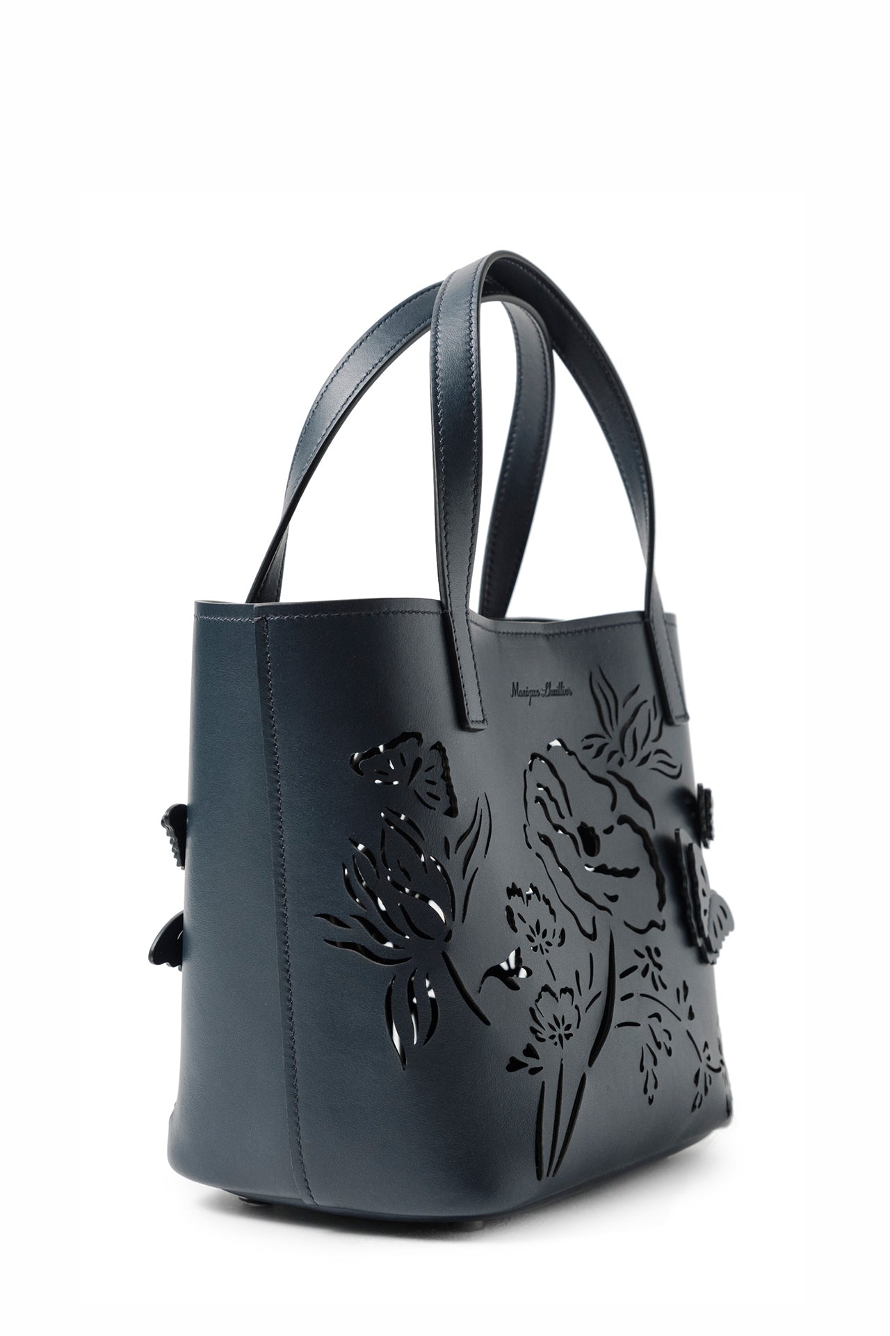 Leather top handle mini tote bag with laser cut florals, three-dimensional leather butterflies and small zip pouch in Navy- side