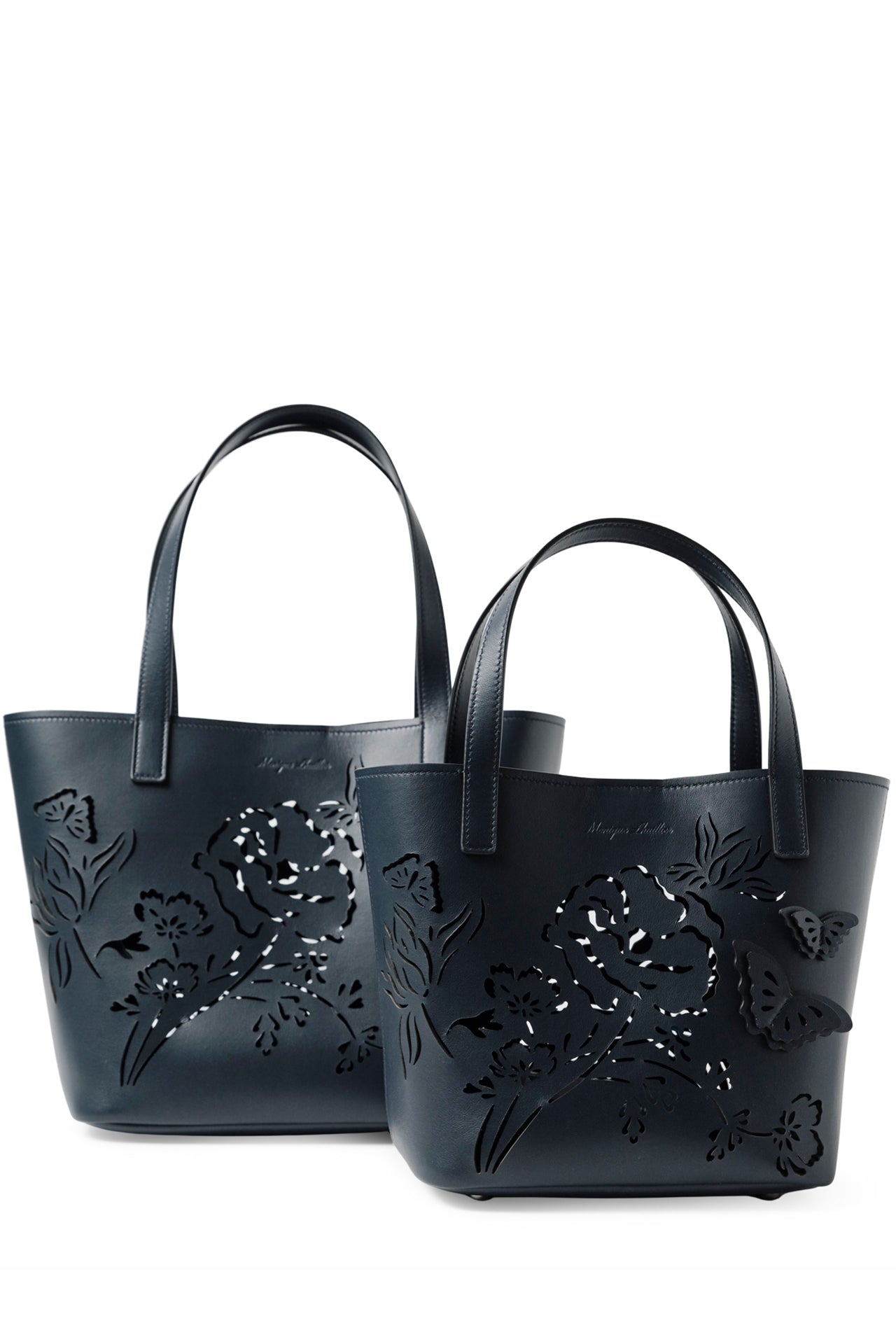 Leather top handle mini tote bag with laser cut florals, three-dimensional leather butterflies and small zip pouch in Navy- front, large and small tote