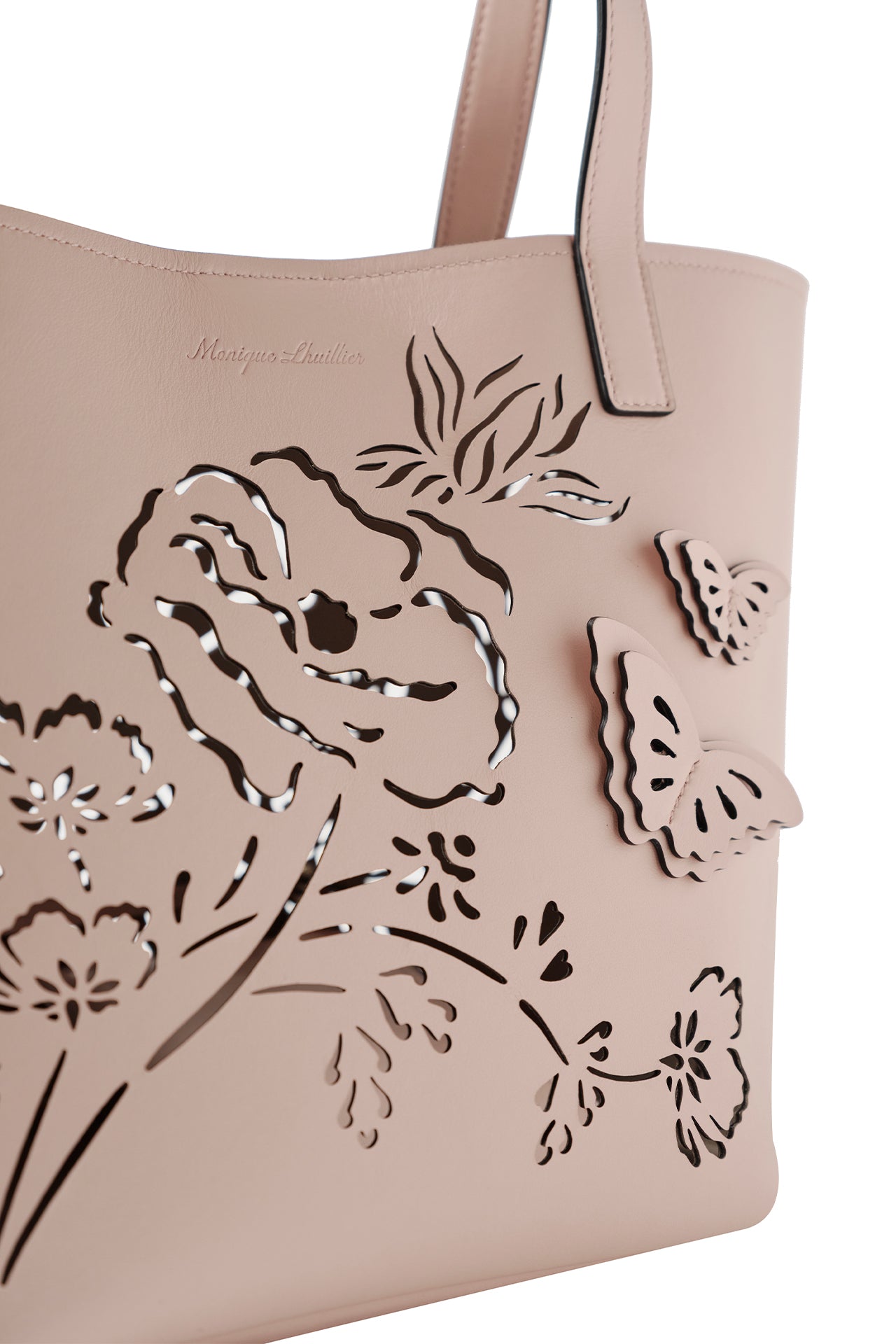 Leather top handle tote bag with laser cut florals, three-dimensional leather butterflies and small zip pouch in Blush- front detail