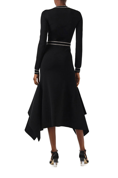 Monique Lhuillier Fall 2024 black knit long sleeve dress with handkerchief hem and self-tie belt - back.