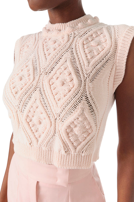 Monique Lhuillier Fall 2024 sleeveless, bobble crop tank in pale blush wool cable knit - front crop.