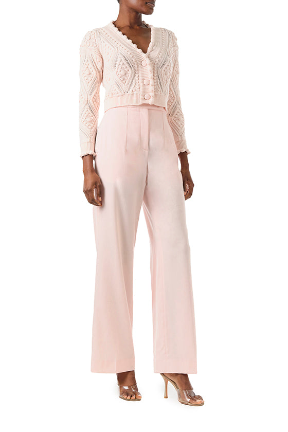 Monique Lhuillier Fall 2024 long sleeve, cropped bobble cardigan in Pale Blush wool cable knit - front.