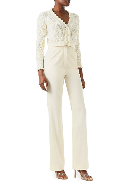 Monique Lhuillier Fall 2024 long sleeve, cropped bobble cardigan in Creme wool cable knit - front.