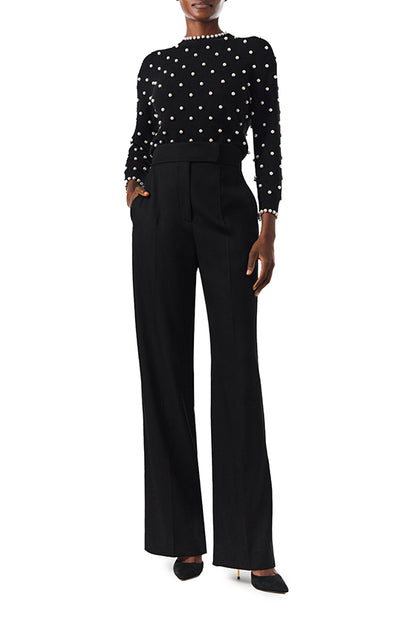 Monique Lhuillier Long sleeve Noir cashmere sweater with pearl embroidery and pearl trim at neckline and wrists - front with pants.