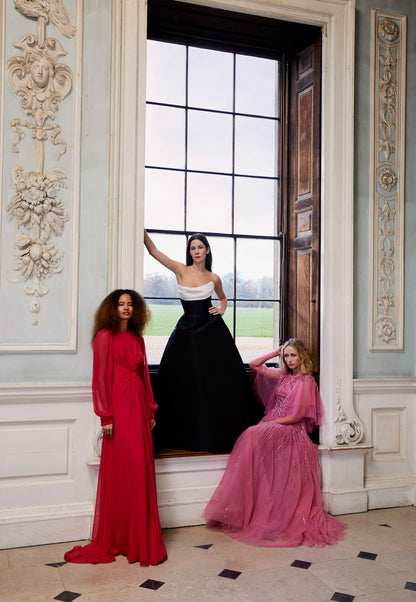 Monique Lhuillier Fall 2024 pomegranate chiffon, long sleeve gown with twist front detail, keyhole back and semi-sheer sleeves - lookbook.