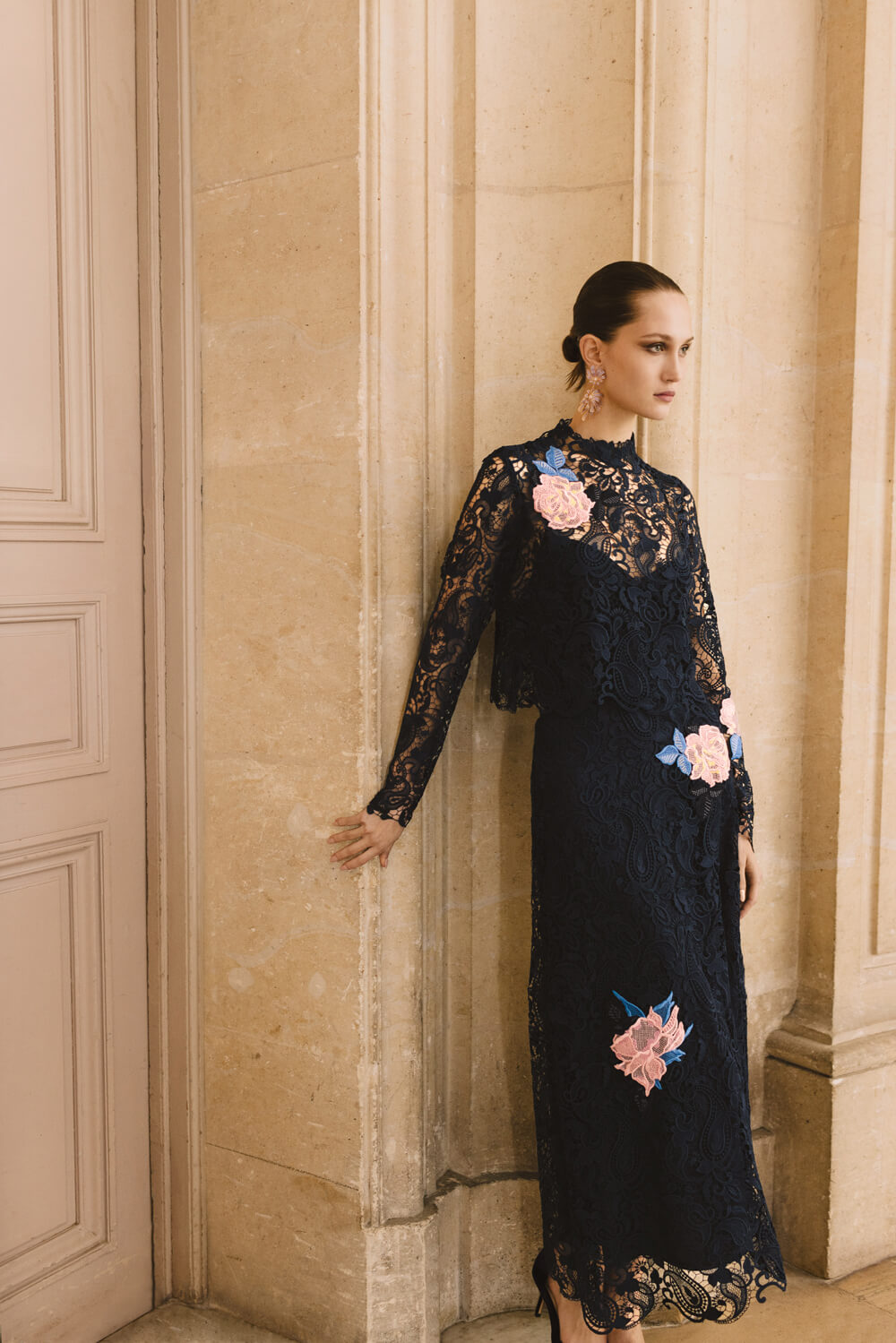 Monique Lhuillier long sleeve navy lace top with pink lace flowers.