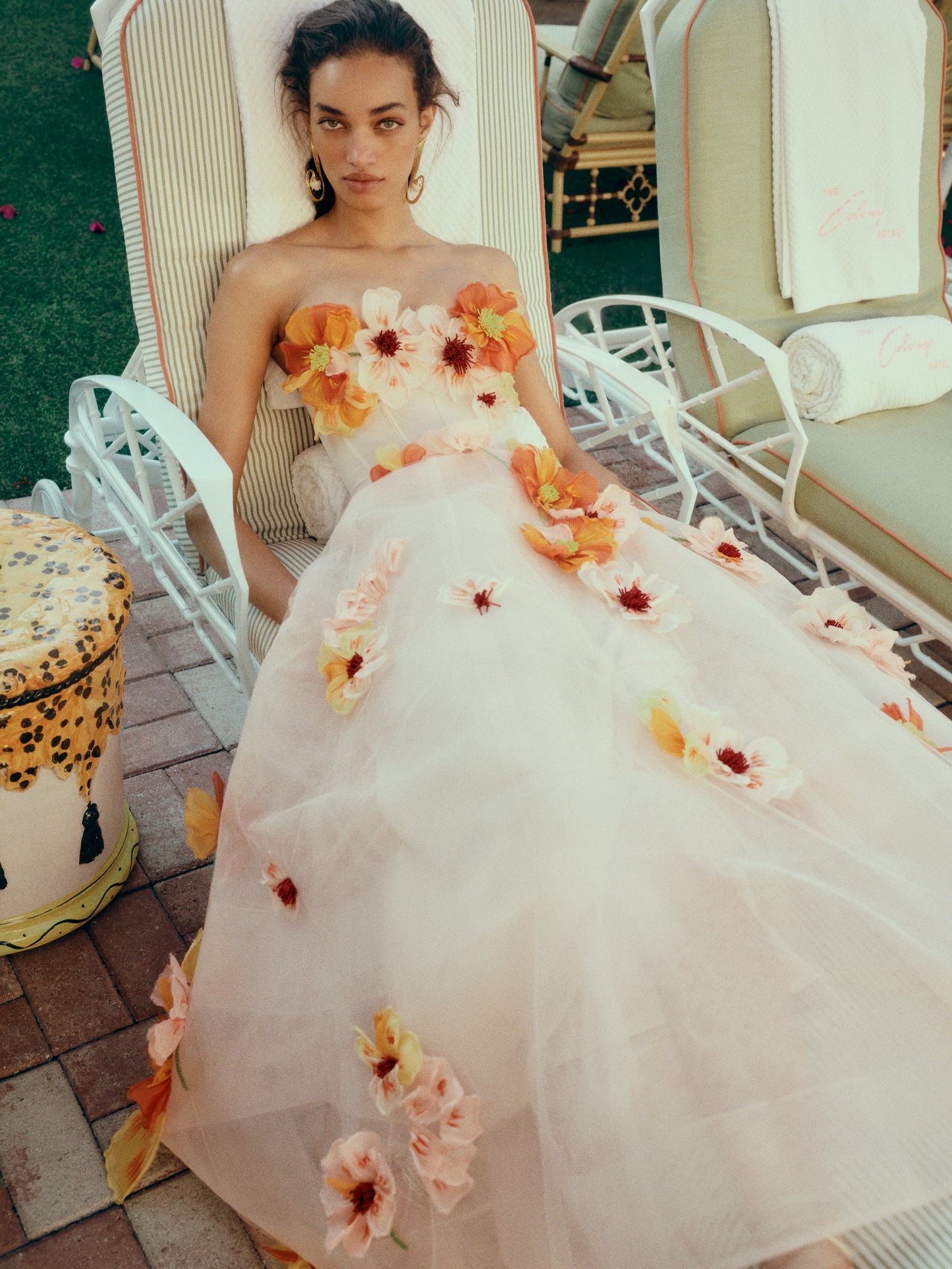 Monique Lhuillier Spring 2025 Strapless, Ecru colored tea-length dress with light boning in bodice and structured horsehair tulle skirt in cascading floral Poppy embroidery - lookbook.