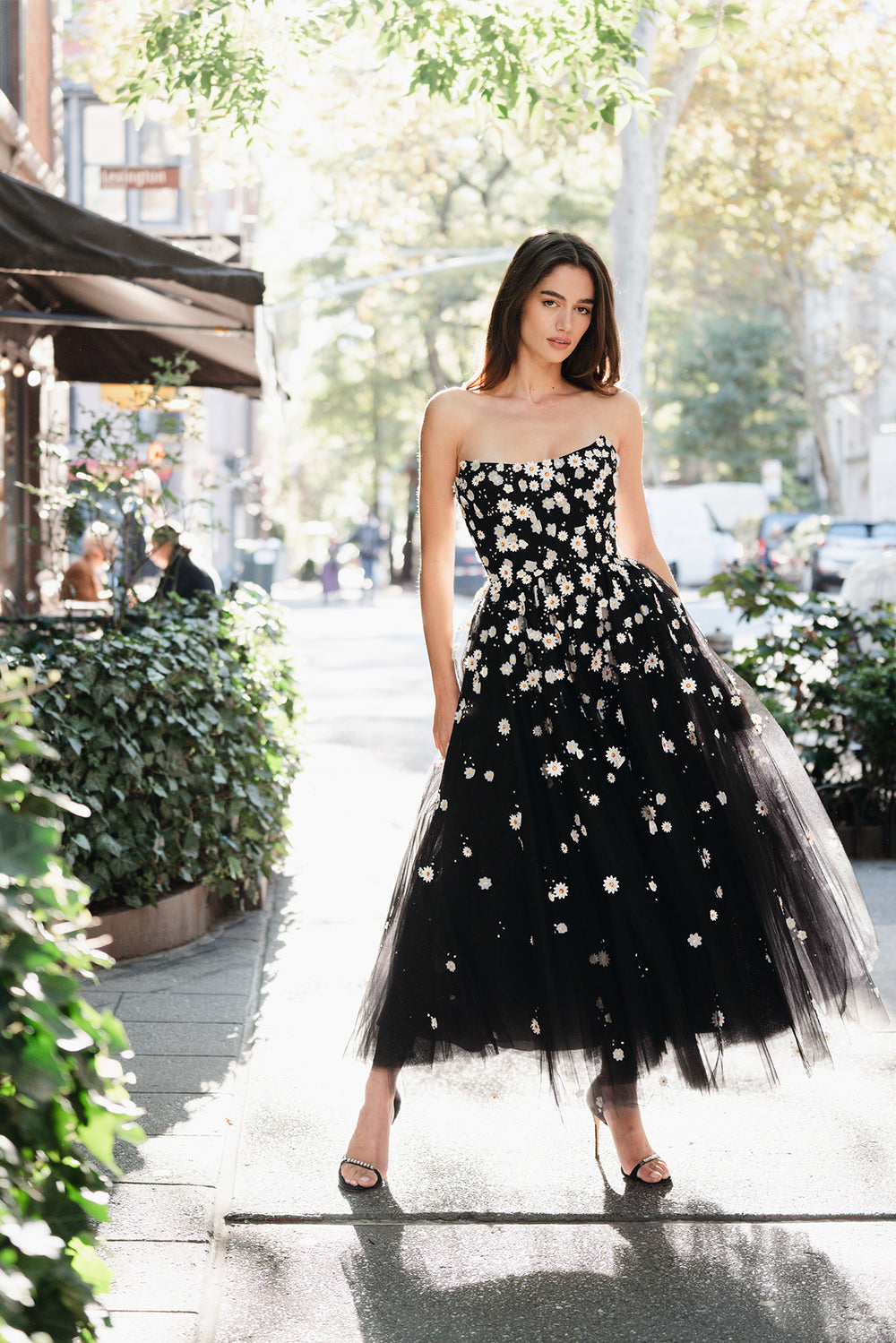 Monique Lhuillier Spring 2025 Noir tulle cape with Daisy embroidery and hook and eye closure at front of neckline - lookbook one.