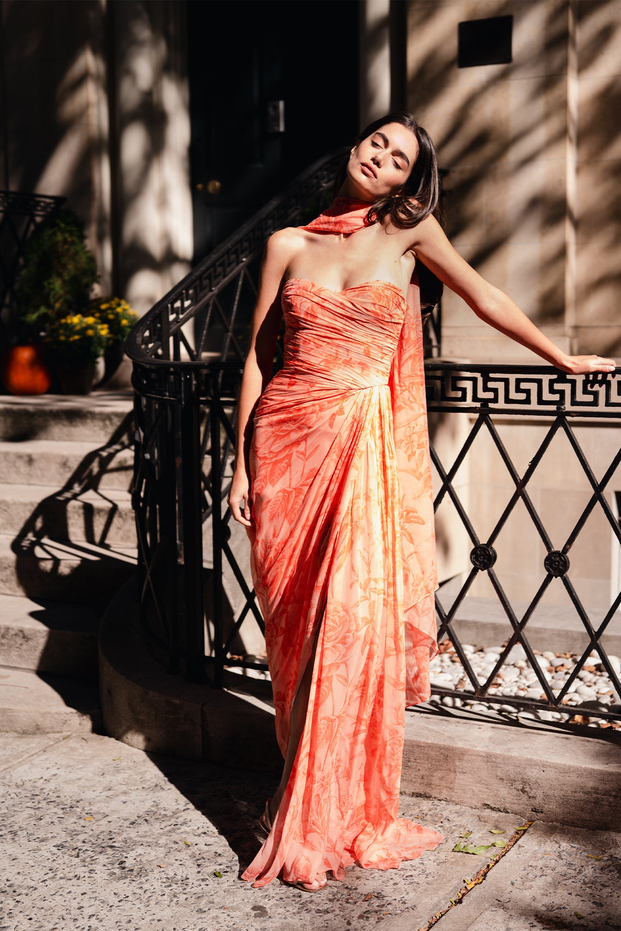 Monique Lhuillier Spring 2025 Strapless floral chiffon gown with draped, sweetheart neckline and detached neck scarf in Rosette Coral color - lookbook photo on model two.