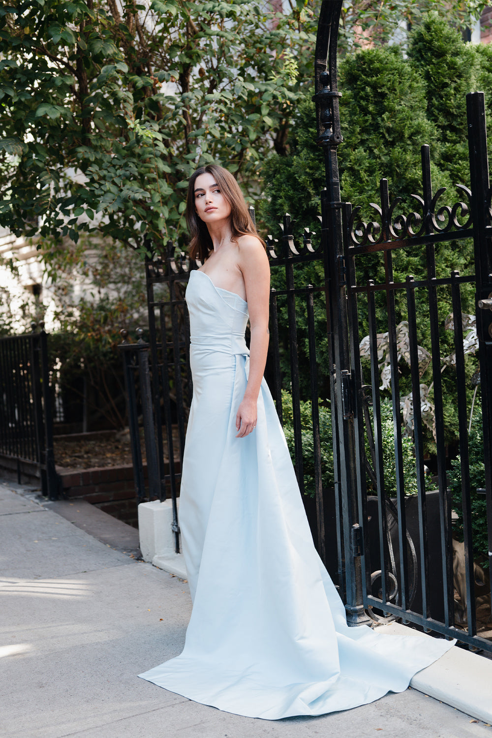 Monique Lhuillier Spring 2025 Strapless, draped column gown with attached train in Powder Blue faille fabric - lookbook two.