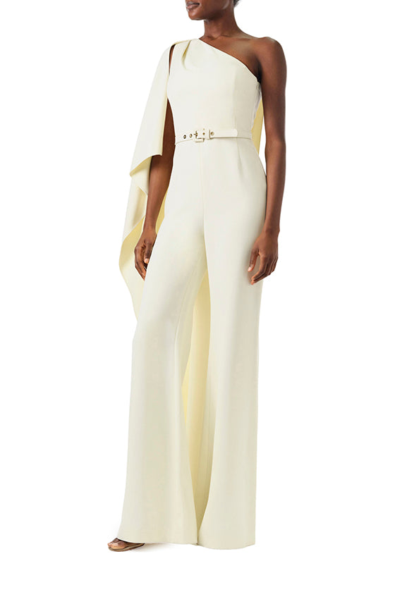 Monique Lhuillier Fall 2024 one shoulder draped jumpsuit with cascading sleeve and belt at waist - left side.