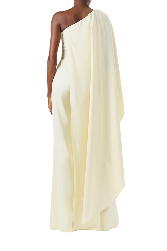 Monique Lhuillier Fall 2024 one shoulder draped jumpsuit with cascading sleeve and belt at waist - back.