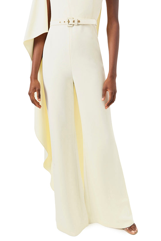 Monique Lhuillier Fall 2024 one shoulder draped jumpsuit with cascading sleeve and belt at waist - pant detail.