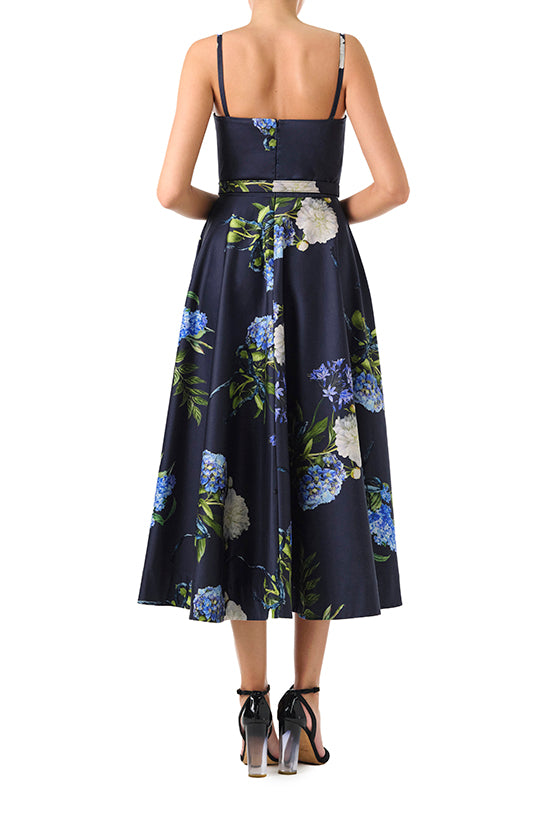 Monique Lhuillier Fall 2024 blue floral spaghetti strap, a-line midi dress with corseted bodice, pockets and belted waist - back.