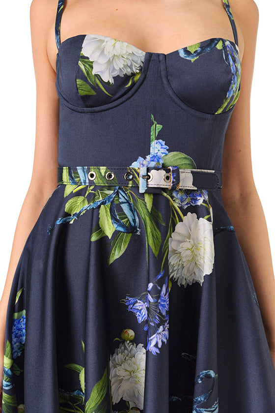 Monique Lhuillier Fall 2024 blue floral spaghetti strap, a-line midi dress with corseted bodice, pockets and belted waist - detail.